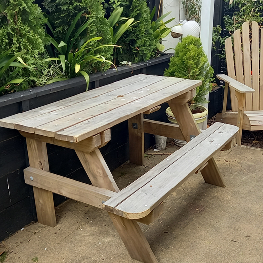 DIY plans for a picnic table with an attached seat along one side