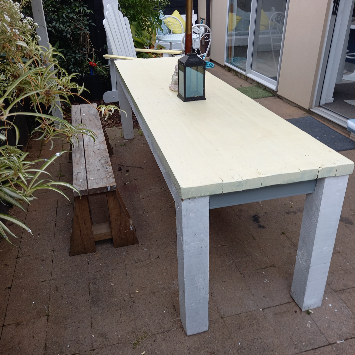 DIY plans to build a rustic 8ft (2.4m) long, narrow outdoor dining table that can seat 12 people
