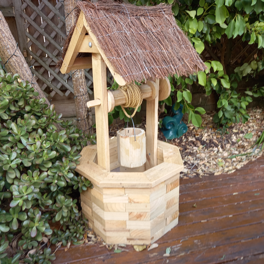 DIY plans to build a wood-brick wishing well with a brushwood roof