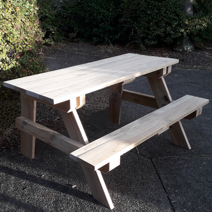 DIY plans for a picnic table with an attached seat along one side