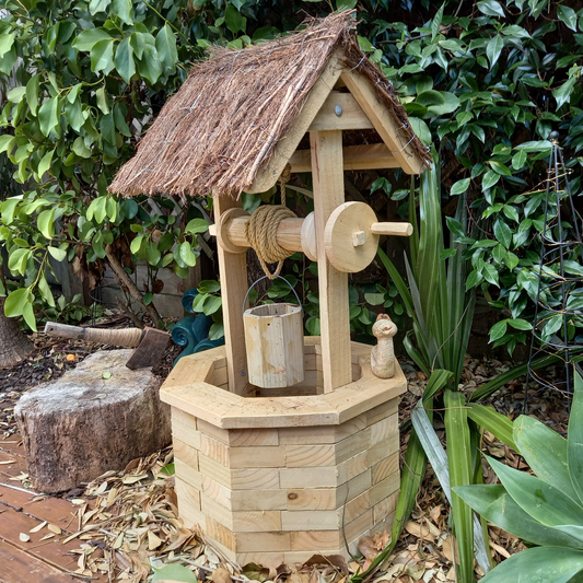 DIY plans to build a wood-brick wishing well with a brushwood roof
